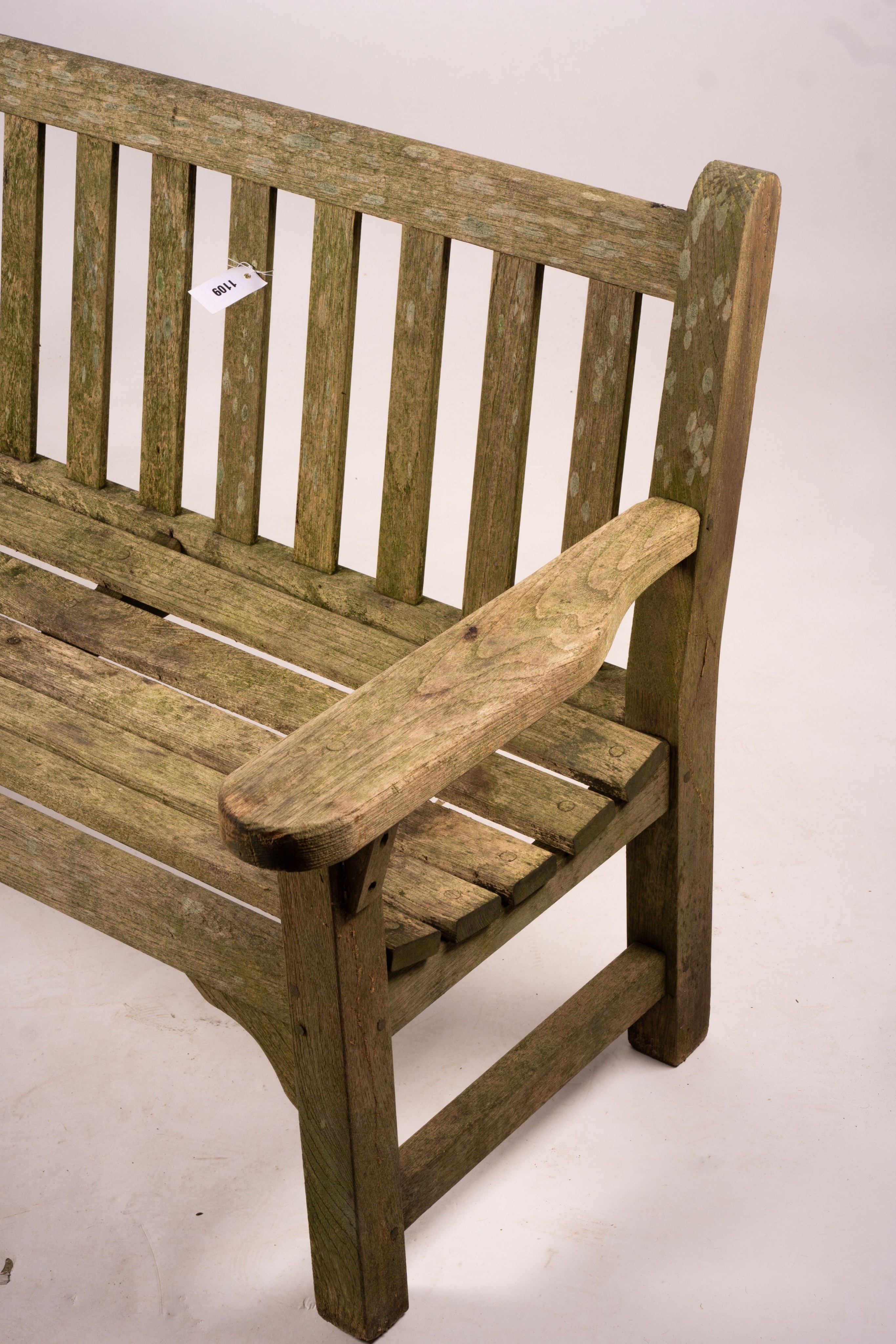 A weathered teak garden bench, length 192cm, width 60cm, height 85cm